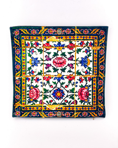 کوسن طرح کاشی سرامیکی سنتی با نقش گل‌های رنگارنگ و طراحی دستی