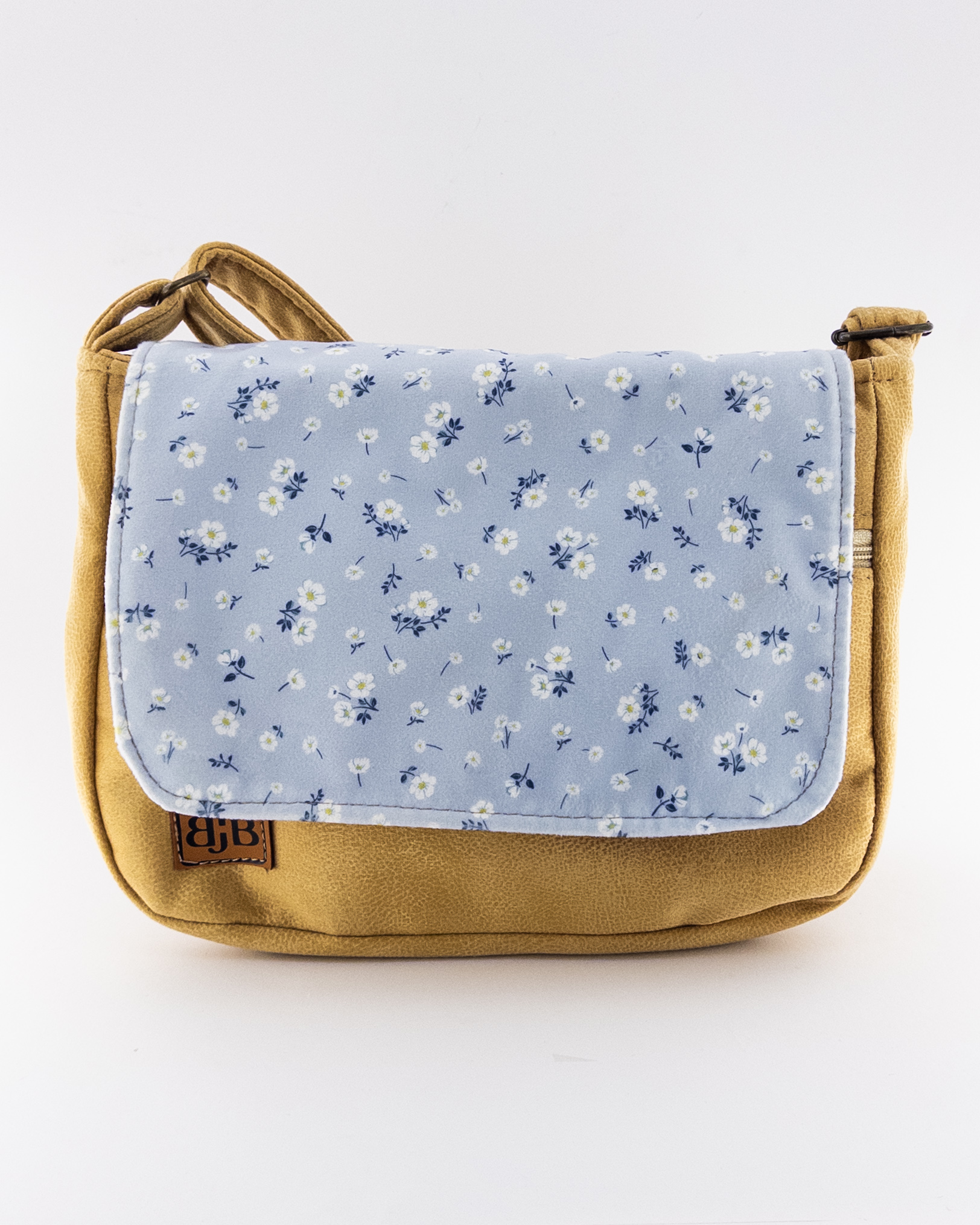 کیف دوشی زنانه مخملی دست‌دوز با زمینه خردلی و طرح گل‌ریز آبی – لطافت رنگی برای استایل‌های روزمره و هنری